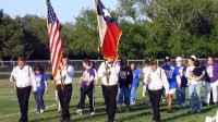 The color guard leads the opening procession.